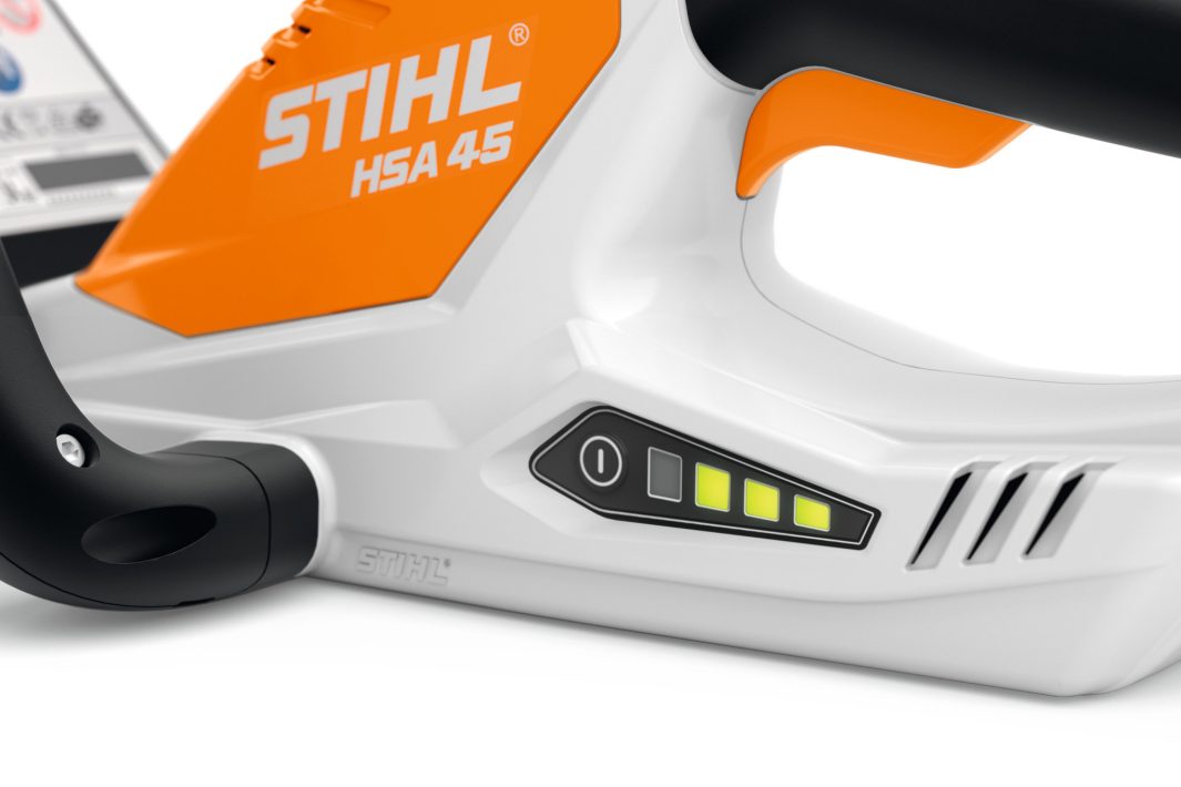 Close-up of the power indicator and handle on the STIHL HSA45 hedge trimmer in white and orange