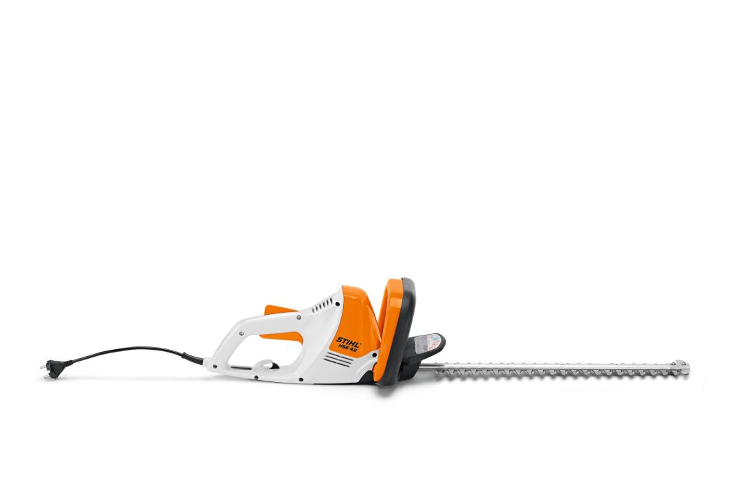 STIHL HSE42 hedge trimmer with orange and white body and long cutting blade on white background