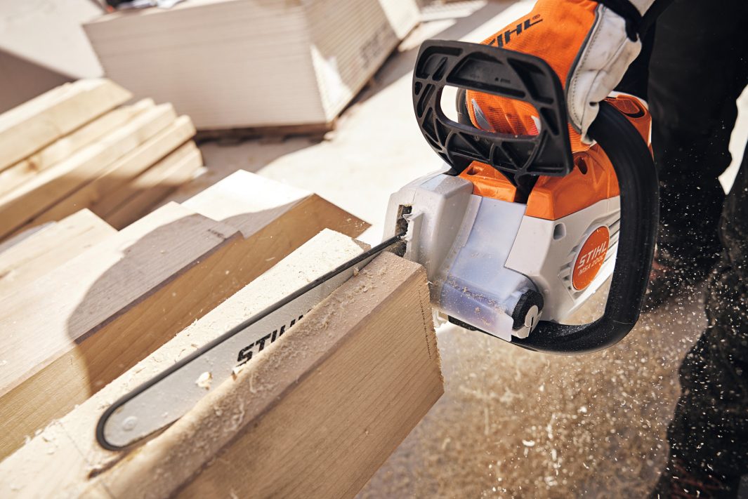 STIHL MSA200 chainsaw for sale cutting through wooden plank with sawdust flying